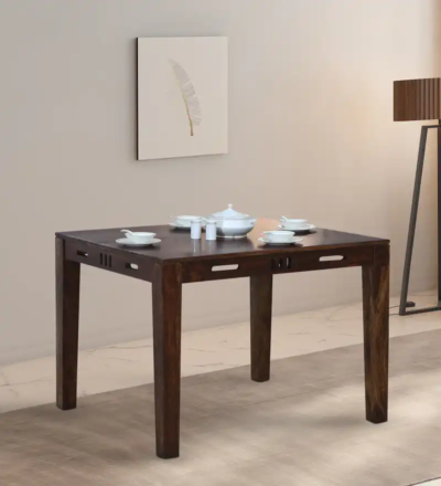 Family dining table with broad wooden base and cushioned seating