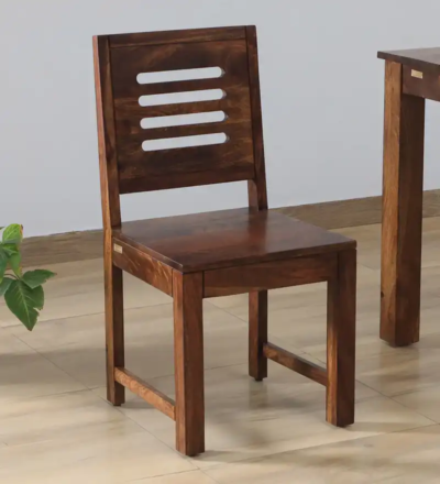 Mirage Solid Wood Dining Chair Set of 2 by Sarve Furniture.​ Front view of Mirage dining chairs showcasing wood grain.​ Side angle of Mirage chairs highlighting ergonomic backrest design.​ Close-up of Mirage chair seat detailing and wood finish.​ Mirage dining chairs in a modern dining room setting by Sarve Furniture.​ Top-down view of Mirage solid wood dining chairs displaying seat design.​ Mirage chairs paired with a matching solid wood dining table.​ Detailed view of Mirage chair leg craftsmanship and joinery.​ Mirage dining chairs with natural wood finish in a cozy dining nook.​ Mirage Solid Wood Dining Chair Set by Sarve Furniture in a contemporary home interior.​