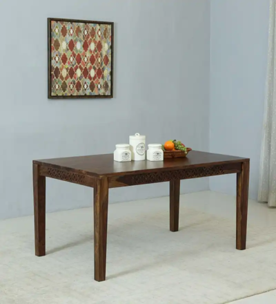 Sturdy wooden dining table with polished surface for family dining