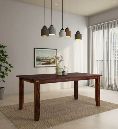Large Sheesham wood dining table with thick top and strong frame for family use