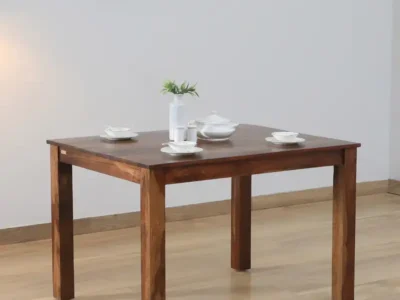 4 seater dining table with elegant cross legs and smooth wood finish
