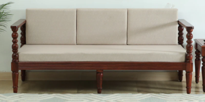 Three seater Sheesham wood sofa with fabric cushions and polish