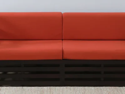 Three seater sofa with fabric upholstery and wooden frame