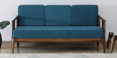 Wooden three seater sofa with side armrests and soft cushions