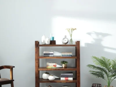 Compact Sheesham wood bookshelf with open display shelves and storage drawers by Sarve Furniture