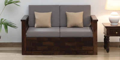 Designer 2 seater sofa with plush fabric and strong wooden legs