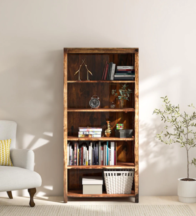 Traditional Sheesham wooden bookcase with carved side panels and natural polish by Sarve Furniture