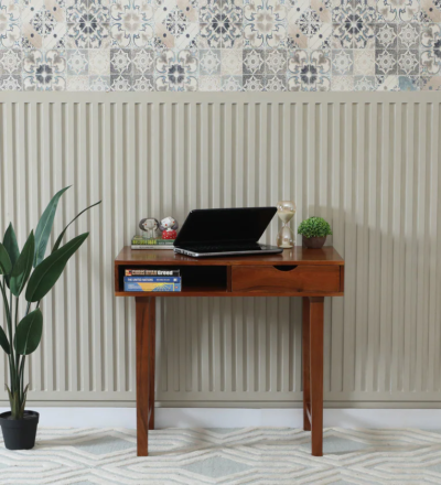 Sturdy study desk with laminated finish and spacious drawer for stationery