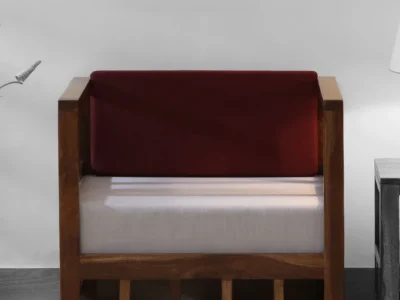 Modern one seater sofa with bold upholstery and wooden frame