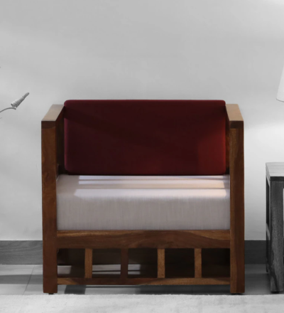 Modern one seater sofa with bold upholstery and wooden frame