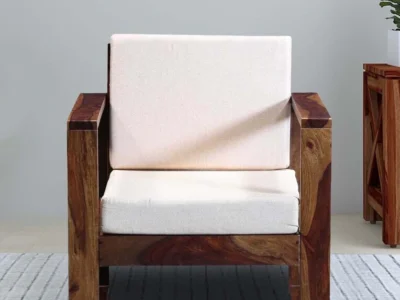 Single seater sofa with velvet fabric and padded armrests