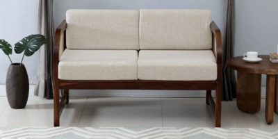 Designer 2 seater couch with soft fabric cushions and clean lines