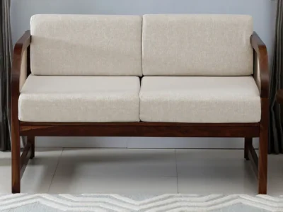 Designer 2 seater couch with soft fabric cushions and clean lines