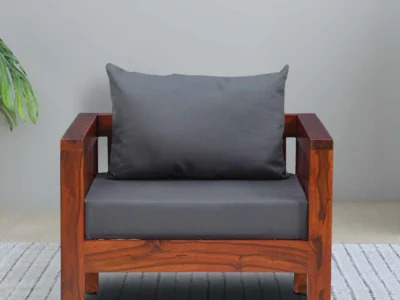 Handcrafted one seater sofa with soft fabric and polished wood frame