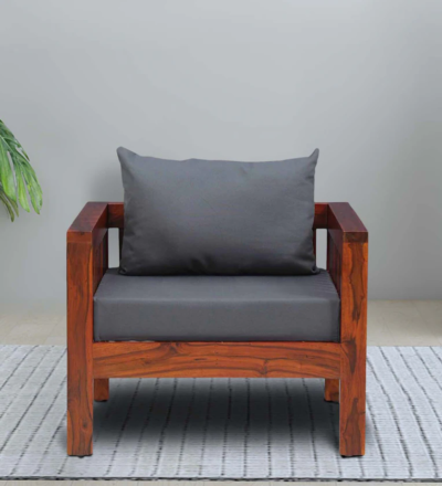 Handcrafted one seater sofa with soft fabric and polished wood frame