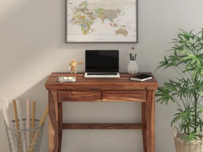 Wooden writing desk featuring smooth finish and multi-tier book rack for organized workspace