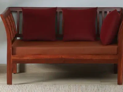 Sheesham wood two seater sofa with fabric finish and side arm support
