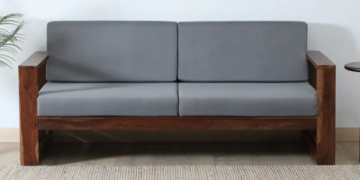 Three seater fabric sofa with wooden base and soft pillow armrests