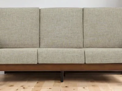 Wooden three seater sofa with cushions for living room or lounge