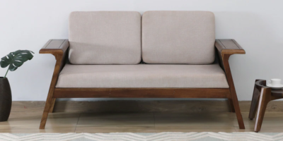 Wooden 2 seater sofa with cushioned arms and seat for everyday use