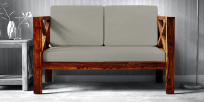 Stylish 2 seater sofa with neutral fabric and wooden legs