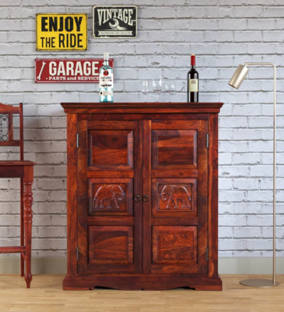 Traditional wooden bar unit Carved bar cabinet with storage Home bar furniture in wood Handcrafted wooden bar unit Designer bar cabinet with doors Wooden wine bottle cabinet Antique-style bar unit Wooden bar furniture with rack Bar unit with carved details Solid wood liquor cabinet