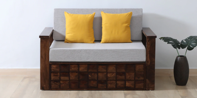 Elegant tufted sofa cum bed with hidden storage compartments