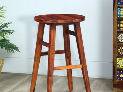 Varrington Sheesham wood bar stools set of 2 by Sarve Furniture Rustic Sheesham wood bar chairs in natural finish Pair of Varrington bar stools with solid wood grain texture Close-up of handcrafted Sheesham wood bar stool seat Sheesham wood bar seating with footrest and ergonomic design Back view of Varrington bar stools showing smooth wood finish Set of 2 Varrington bar stools for kitchen or home bar Natural wood bar stools made from premium Sheesham by Sarve Indian rosewood bar stools set with stylish silhouette Varrington bar stools in Sheesham wood with rustic appeal