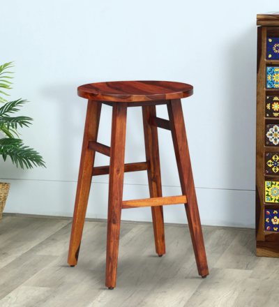 Varrington Sheesham wood bar stools set of 2 by Sarve Furniture Rustic Sheesham wood bar chairs in natural finish Pair of Varrington bar stools with solid wood grain texture Close-up of handcrafted Sheesham wood bar stool seat Sheesham wood bar seating with footrest and ergonomic design Back view of Varrington bar stools showing smooth wood finish Set of 2 Varrington bar stools for kitchen or home bar Natural wood bar stools made from premium Sheesham by Sarve Indian rosewood bar stools set with stylish silhouette Varrington bar stools in Sheesham wood with rustic appeal