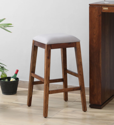Horizon Sheesham wood bar stools set of 2 by Sarve Furniture Close-up of Horizon Sheesham wood seat and legs – handcrafted finish Pair of Horizon Sheesham bar stools in rustic polish Horizon bar stools made of solid Sheesham wood with sleek design Side angle of Horizon bar stools showing footrest and support Stylish Horizon wooden bar stools for kitchen and bar use Horizon Sheesham bar stools with natural grain texture Modern and rustic Horizon bar stool set – handcrafted in wood Elegant Sheesham wood bar stools by Sarve Furniture – Horizon design Horizon bar stool set placed in a cozy modern home bar setup