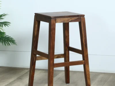 Eclipse Sheesham wood bar stool by Sarve Furniture with natural finish Close-up of handcrafted Eclipse Sheesham wood bar stool seat Stylish Eclipse Sheesham bar stool with ergonomic backrest Eclipse Sheesham wood bar stool featuring rich wood grain texture Side view of Eclipse Sheesham wood bar stool with footrest Sleek and modern Eclipse Sheesham wood bar stool design Full view of Eclipse Sheesham wood bar stool in contemporary space High-quality Eclipse Sheesham wood bar stool with natural polish Handcrafted Eclipse bar stool made from solid Sheesham wood Rustic and elegant Eclipse Sheesham bar stool with smooth finish