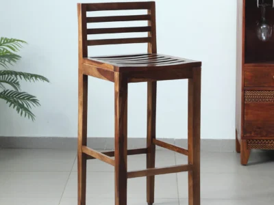 Bar stool with natural finish Solid Sheesham bar seating Wooden bar chair for home Natural grain wood stool Rustic wood bar stool High chair for bar counter Sheesham wood kitchen stool Comfort seat wooden stool Designer bar stool in wood Home bar furniture stool